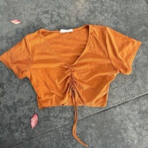 Thrifted orange ruched top